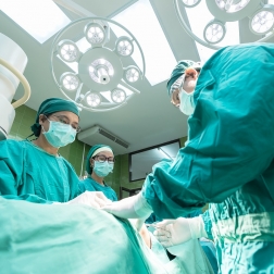 Surgical team operates on patient