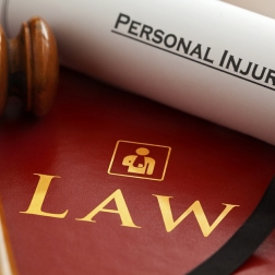 personal injury law document next to gavel