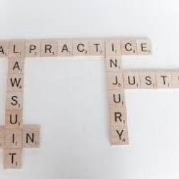 scrabble letters placed on a white background