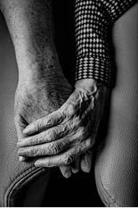 elderly-couple-holding-hands